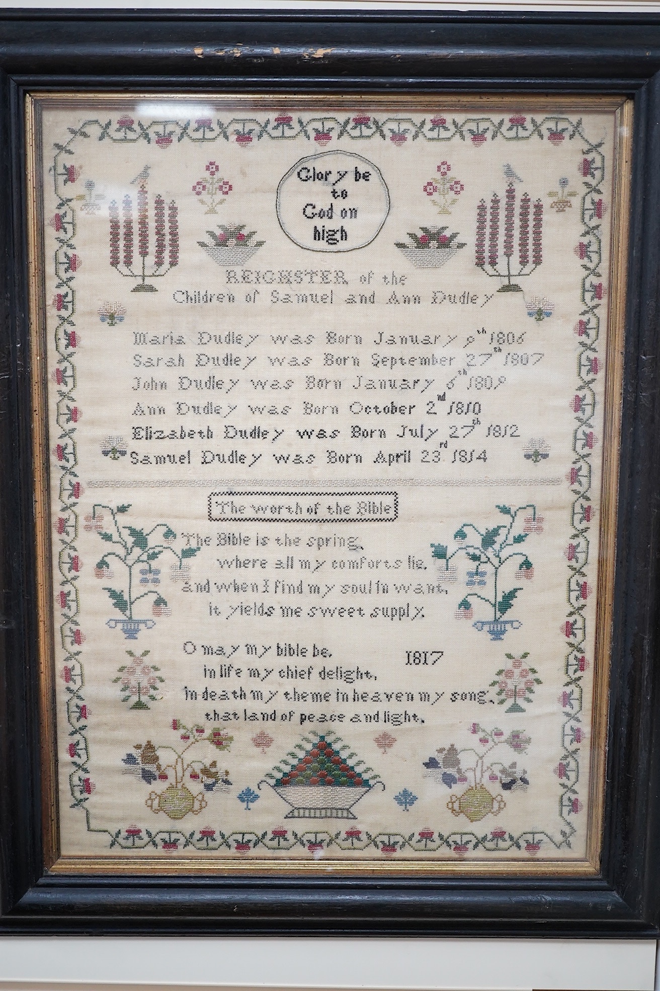 Two early 19th century finely worked samplers: One 'A Sublime Thought', dated 1822 by Ann Dudley, simply worked with verse and a wide vineous border and two oak trees, the other a register of the children of Samuel and A